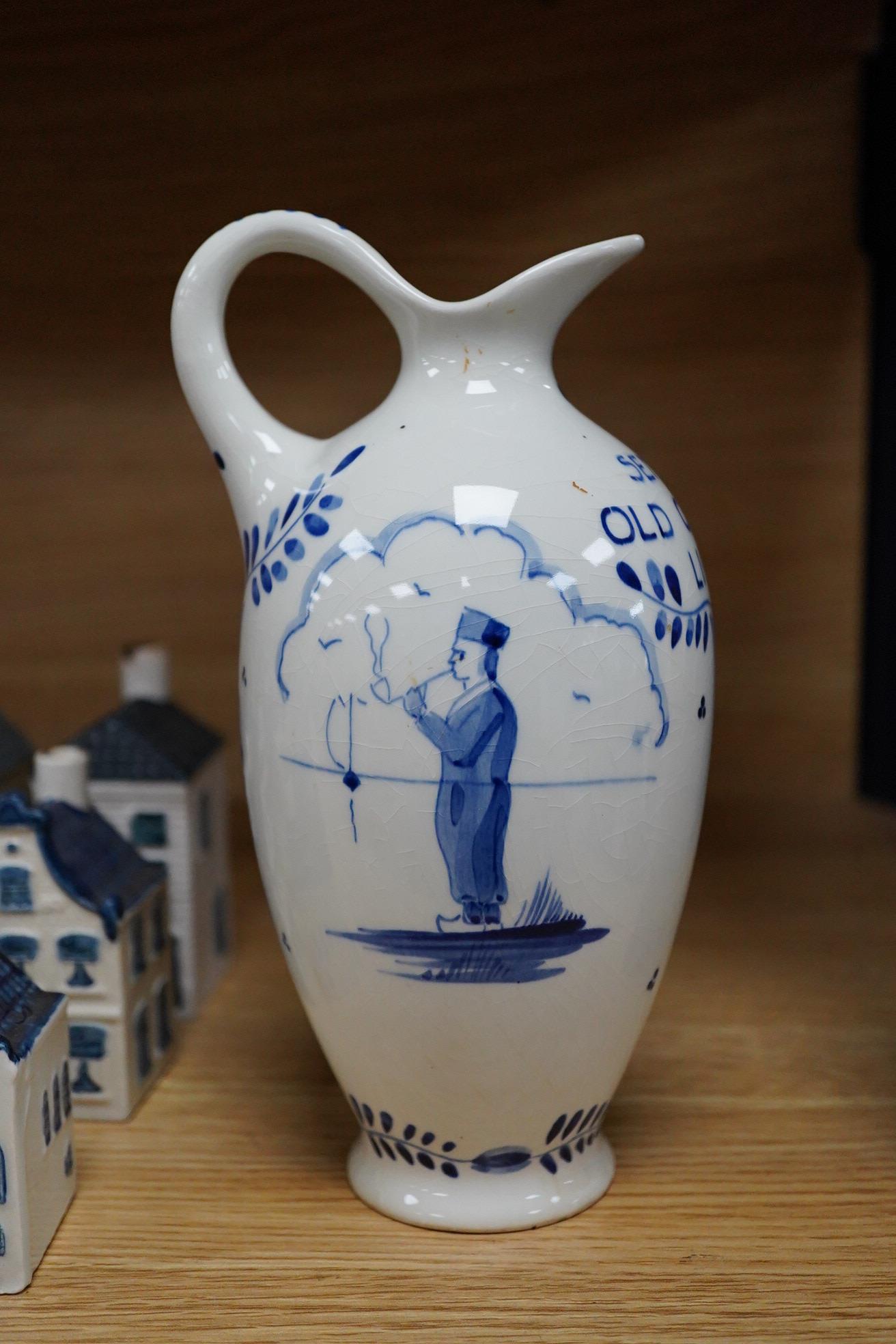 A collection of twenty seven KLM Delft blue miniature houses presented to Business class passengers together with a Delft jug - 20.5cm high